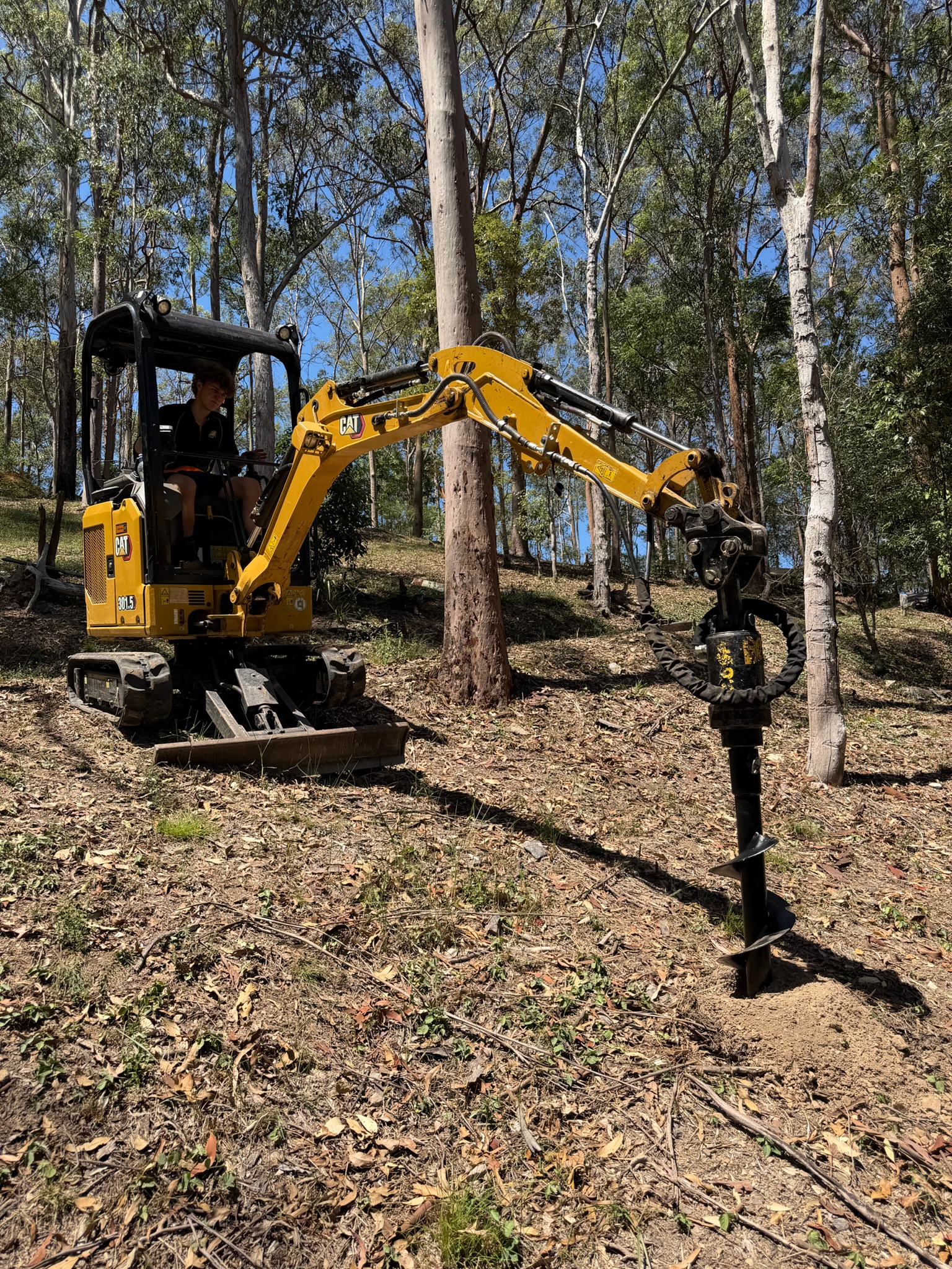 Post hole auger attachment